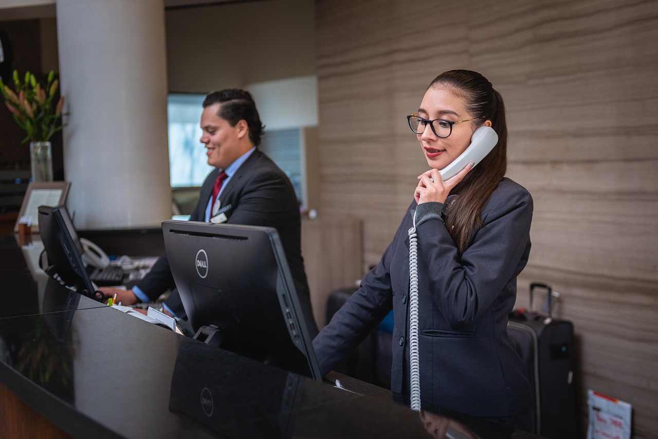 Receptionists, phone call, hotel — Max Herve George Provides Forward-Looking Leadership in Finance